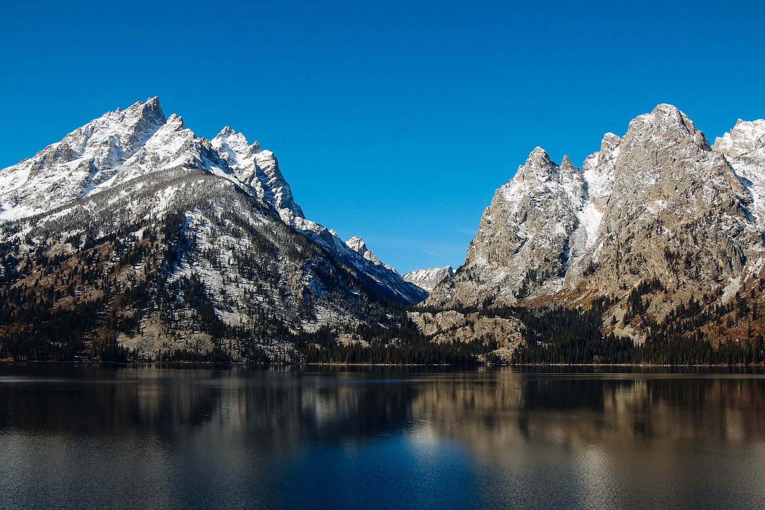 Jenny Lake at dawn, the Tetons reflected in still water